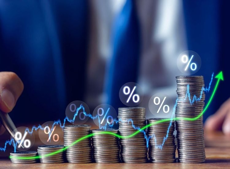 Businessman putting down money, pointing with pen and showing candlestick symbol for investing, finance, saving money, interest rate or dividend investment, business growth concept.